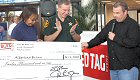 Checks totaling $24,000 were presented to the families of two local law enforcement officers who died in the line of duty by syndicated Bubba the Love Sponge and those of local businesses that raised funds.  